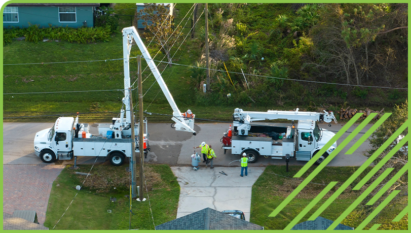Lift trucks removing storm damage for electrical power