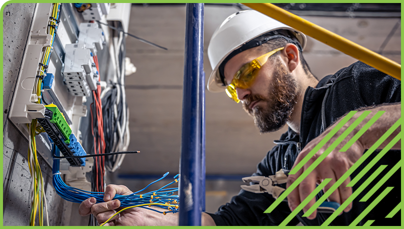 Worker installing electrical pannel 